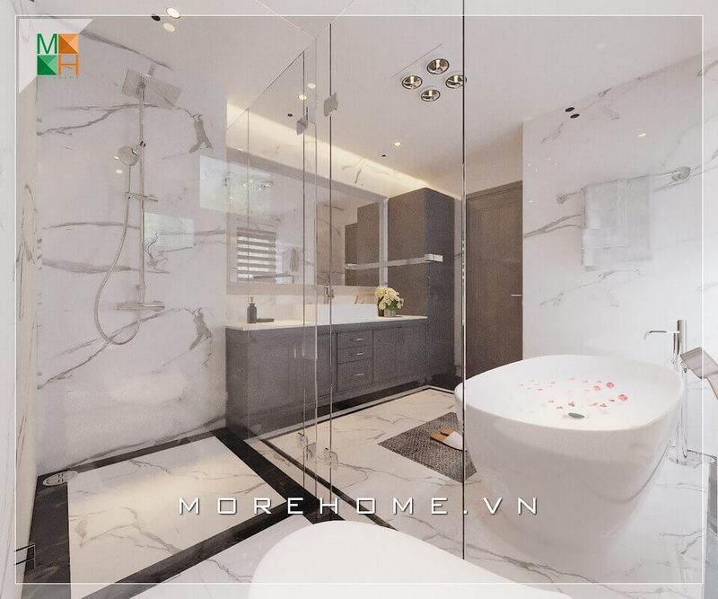 .
Với diện tích lớn, phòng tắm có thể được chia thành các khu vực bằng vách tắm bằng kính cường lực như khu vực tắm đứng, khu vực vệ sinh, khu vực tắm bồn và khu tủ lavabo. Điều này giúp ngăn nước và giữ sàn khô ráo, cũng như tạo ra một không gian liên kết trong phòng tắm.